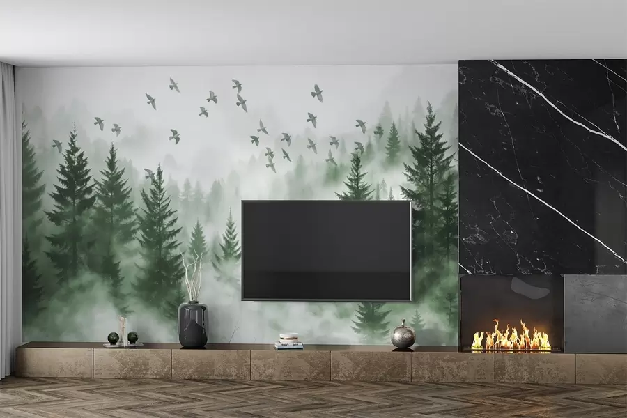 murais de parede Floresta tranquila e enevoada com árvores em tons de verde e um bando de pássaros a voar no céu  w08664v1