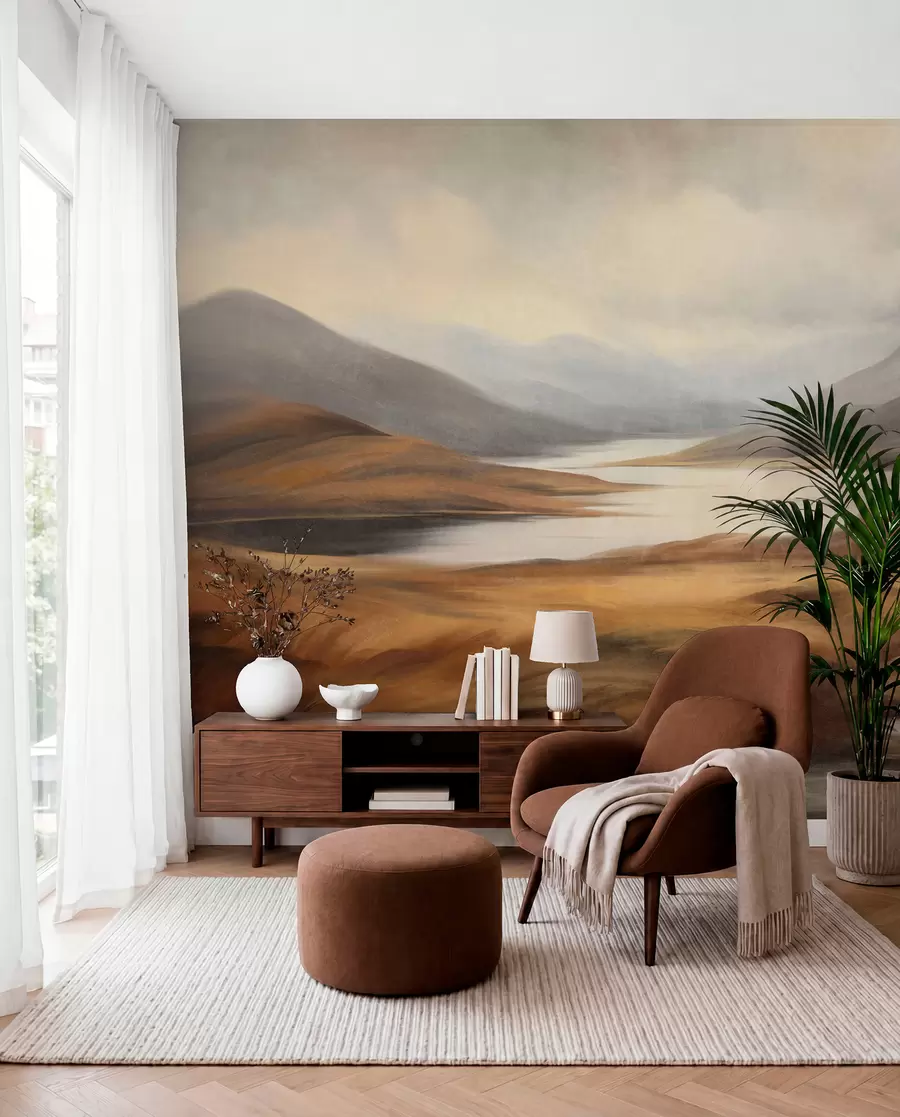 murais de parede Paisagem acidentada, lago rodeado por colinas e montanhas sob um céu nublado com erva seca w09756